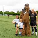Marco Sementa with his two daughters and Chewbacca at Team Sementa's 200th charity football match