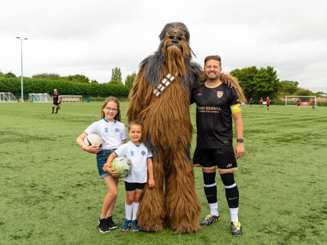 Marco Sementa with his two daughters and Chewbacca at Team Sementa's 200th charity football match