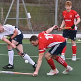 Gareth Andrew (red) in action for City of Peterborough against Birmingham University. Photo: David Lowndes.