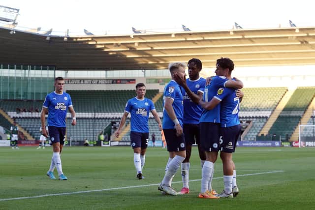 Ricky-Jade Jones of Peterborough United celebrates scoring the opening goal of the game. Photo: Joe Dent.