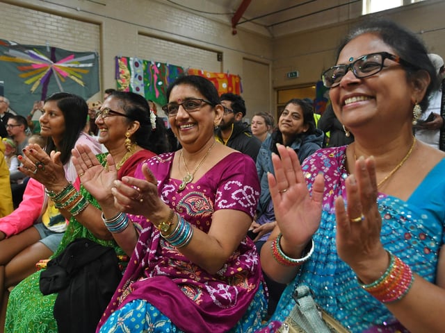 Bharat Hindu Samaj performers enjoying the other stage acts.