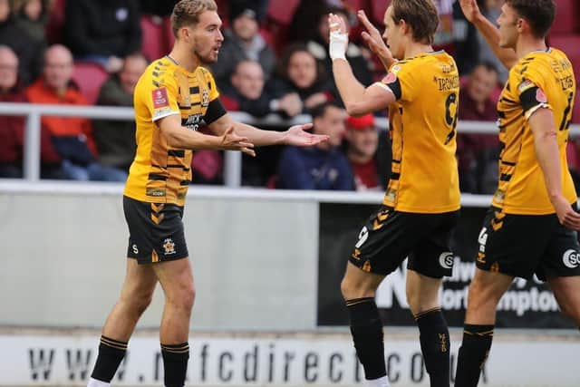 Sam Smith (left) celebrates a goal for Cambridge United. (Photo by Pete Norton/Getty Images)