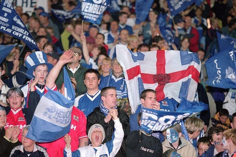 Peterborough fans celebrate a win to remember.