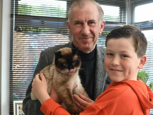 Pavlo Udovychenko (10) with step-dad Frank Anderson and the cat from Ukraine Murchik at their home in Thorney (image: David Lowndes)