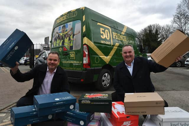 Mark and Dale Asplin, directors of Princebuild, in Peterborough, with some of their aid parcels for Ukraine.