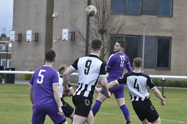 Action from Stanground Sports (purple) v Oundle Town in the Peterborough League Cup. Photo: David Lowndes.