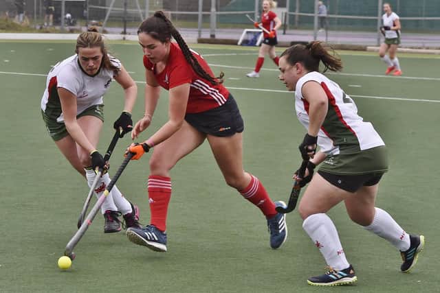 Eva Stones (red) in action for City of Peterborough Ladies 2nds v Norwich Dragons. Photo: David Lowndes