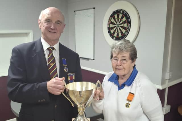 Northants women's president Jess Bolam and Northants men's chairman Martyn Dolby with the Ean Eagle Trophy.