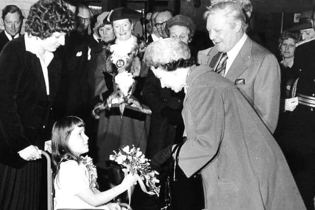 Lorraine Cherry, from Werrington, presents a bouquet to the Queen during a visit to Peterborough in 1978.
