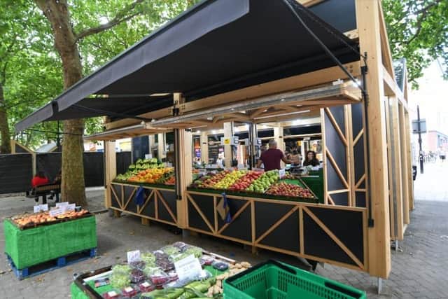 Outdoor wooden kiosks at the new Bridge Street market