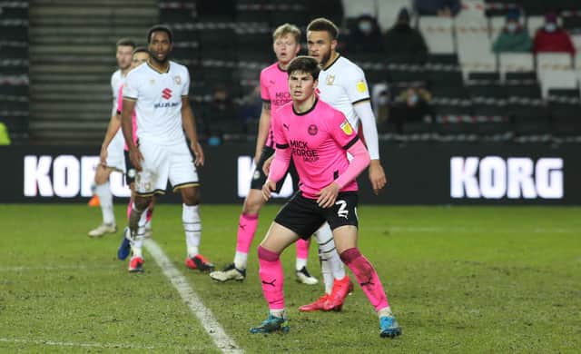 Ronnie Edwards on his Football League debut at MK Dons in December, 2020. Photo: Joe Dent/theposh.com.