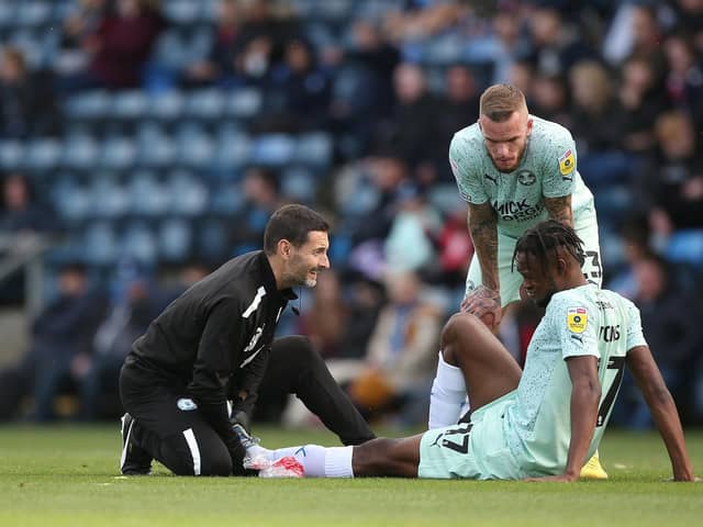 Ricky-Jade Jones receives treatment after getting injured against Wycombe in October.  Photo: Joe Dent.