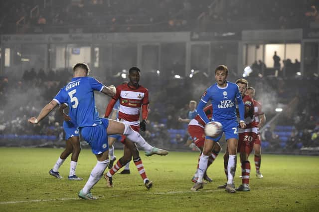 Posh centre-back Josh Knight saw this volley at goal well blocked by a Doncaster defender. Photo: David Lowndes.