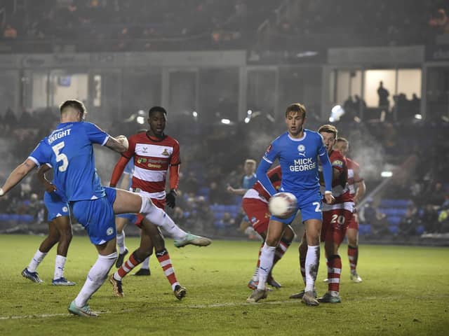 Posh centre-back Josh Knight saw this volley at goal well blocked by a Doncaster defender. Photo: David Lowndes.