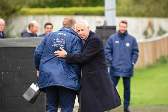 Peterborough Sports chairman Grant Biddle congratulates manager Jimmy Dean. Photo: James Richardson.