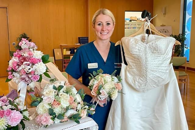 Critical Outreach Nurse Practitioner Natasha Steels-Webb with some of the wedding items donated over recent weeks.