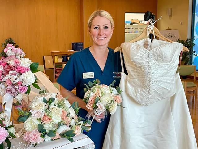 Critical Outreach Nurse Practitioner Natasha Steels-Webb with some of the wedding items donated over recent weeks.