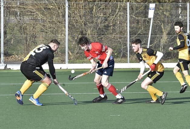 Matt Goodley (red) in action for City of Peterborough against Beeston. Photo: David Lowndes