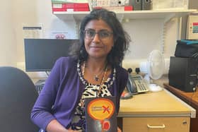 Macmillan consultant urological surgeon Jyoti Shah MBE with her book