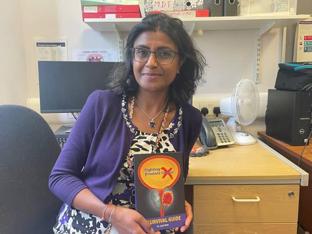 Macmillan consultant urological surgeon Jyoti Shah MBE with her book