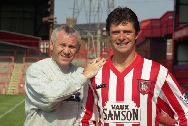 Niall Quinn signs for Sunderland in 1996, with Peter Reid there to greet him.