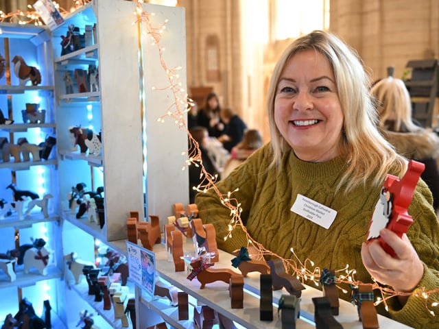 Karen Dixon with her Christmas decorations at Peterborough Cathedral Christmas market.