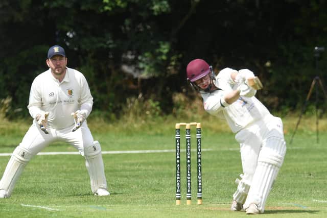Sam Higgins hits a six for Castor against Stamford Town. Photo: David Lowndes.