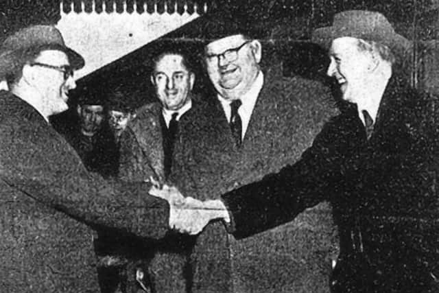 Embassy manager Jack Bancroft (left) greets Laurel and Hardy at Peterborough North station.