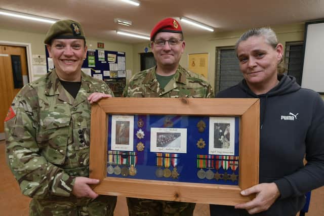 Caron Blackall with her medals returned by Col Lesley Deacon and Sgt Phil Peal of  the Talavera Detachment No1 Company Cambs ACF 