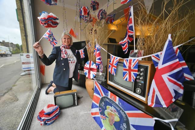 Hayley Cotton-Shelton at Cotton's TV shop at Oundle Road with their Jubilee window display