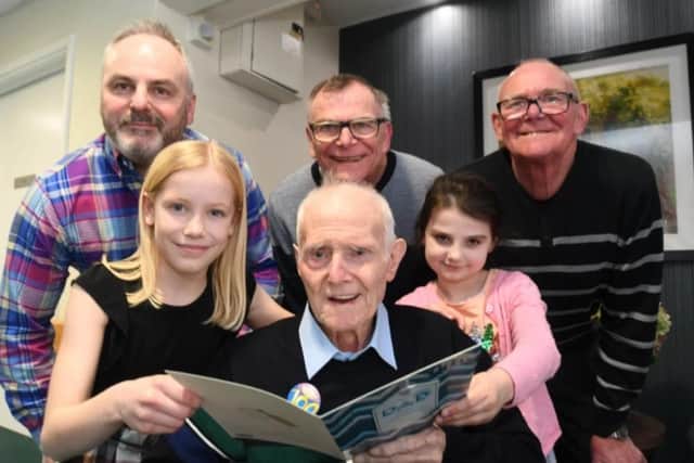 John Pusey celebrating his 100th birthday at Baron Court Care Home at Werrington with members of five generations of his family, including John Pusey (grandson), John Pusey (son) Dave Pusey (son), Molly Smith (great-granddaughter) and Ava Pusey (great-great-granddaughter).