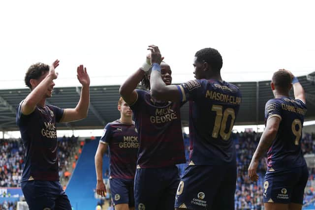 Posh celebrate Ephron Mason-Clark's winning goal at Reading. Photo: Joe Dent/theposh.com.