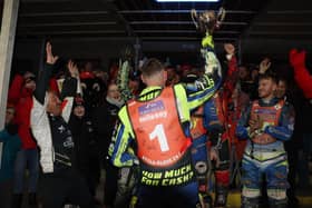 Peterborough Panthers fans and riders at the end of the meeting together with the trophy. Photo: Andy Dann.