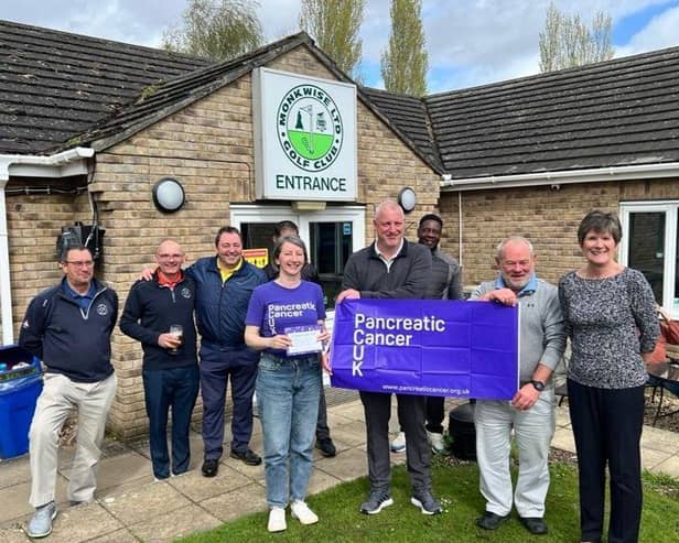 From the right, Chris Bennett, Steve Steels, Rob Bye and a volunteer from Pancreatic Cancer UK along with some of the Gedney Hill Golf Club members.