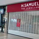Notices in the window inform shoppers of the closure of jeweller H Samuel in the Queensgate Shopping Centre in Peterborough.
