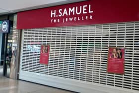 Notices in the window inform shoppers of the closure of jeweller H Samuel in the Queensgate Shopping Centre in Peterborough.