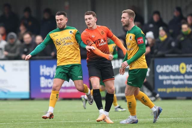 Dan Lawlor (orange) scored for Peterborough Sports against Alfreton. Photo: Natalie Mayhew