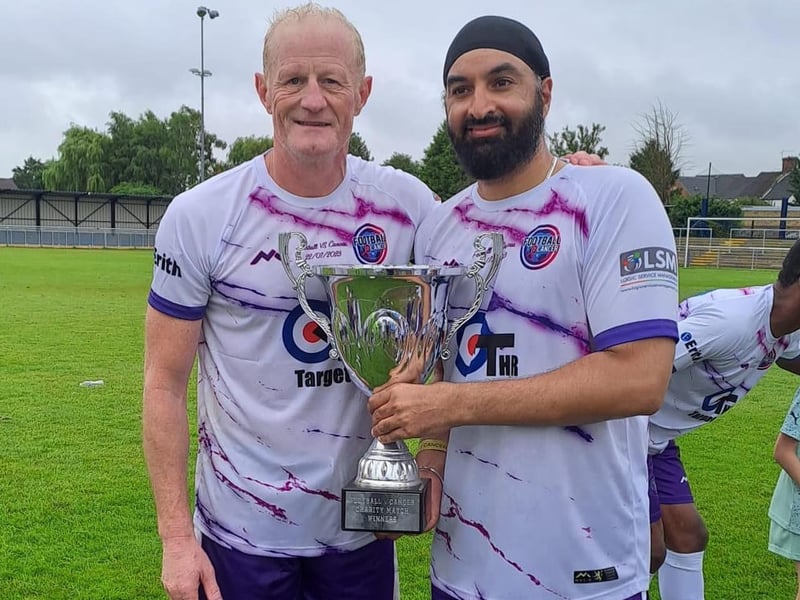 Colin Hendry lifts the trophy with Monty Panesar.