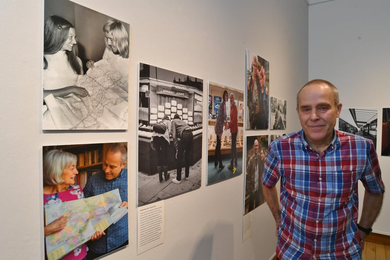 Chris Porsz standing, poignantly, beside his own 'then and now' photo set featuring his late wife, Lesley.