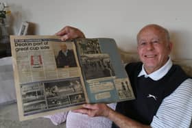 Former Posh player Peter Deakin looking through an old scrapbook on Peterborough United games in the 60's. Photo: David Lowndes.