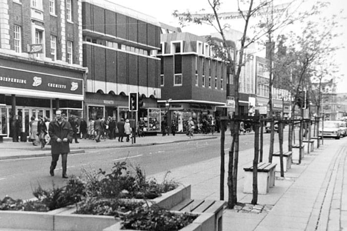 A pre-pedestrianised Bridge Street, showing shoppers making full use of one of the very many Boots stores that have adorned the city over the past hundred years.