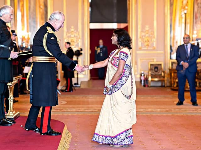 Miss Jyoti Shah MBE attending the recent investiture at Buckingham Palace with King Charles.