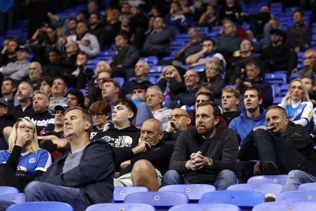 Peterborough fans look dejected after Reading score their second goal during the Sky Bet Championship match between Reading and Peterborough United at Madejski Stadium on September 14, 2021.