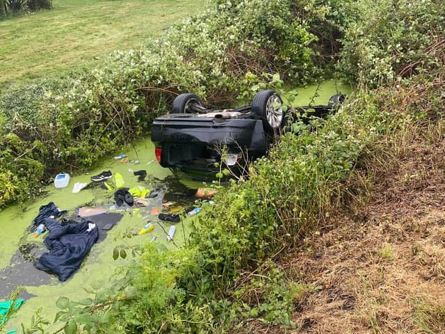 The car that overturned in the ditch at Horsey toll.