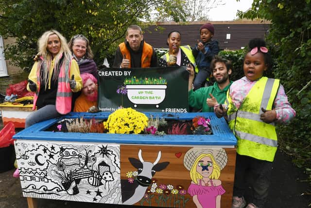 Cllr Heather Skibsted and volunteers from Up the Garden Bath planting five recycled baths  at a community area at Lythmere, Orton Malbourne, Peterborough.