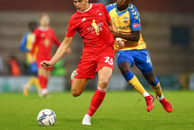 Hector Kyprianou (red) in action for Orient. Photo by Jacques Feeney/Getty Images