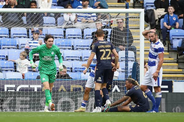 Romoney Crichlow (seated) has just made a brilliant block to thwart Andy Carroll (right) at Reading on the opening day of the League One season to the delight of Posh goalkeeper Nicholas Bilokapic. Photo: Joe Dent/theposh.com.