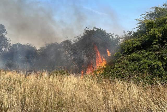 Firefighters put out field fire off Gidding Road, Sawtry
