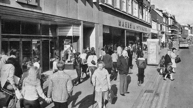 A busy Bridge Street full of shoppers in 1982, just before the official opening of the Queensgate Shopping Centre.