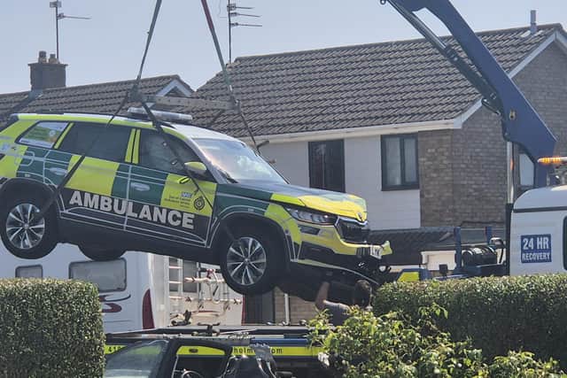 The ambulance rapid response vehicle is taken away from the scene of a traffic collision in Whittlesey